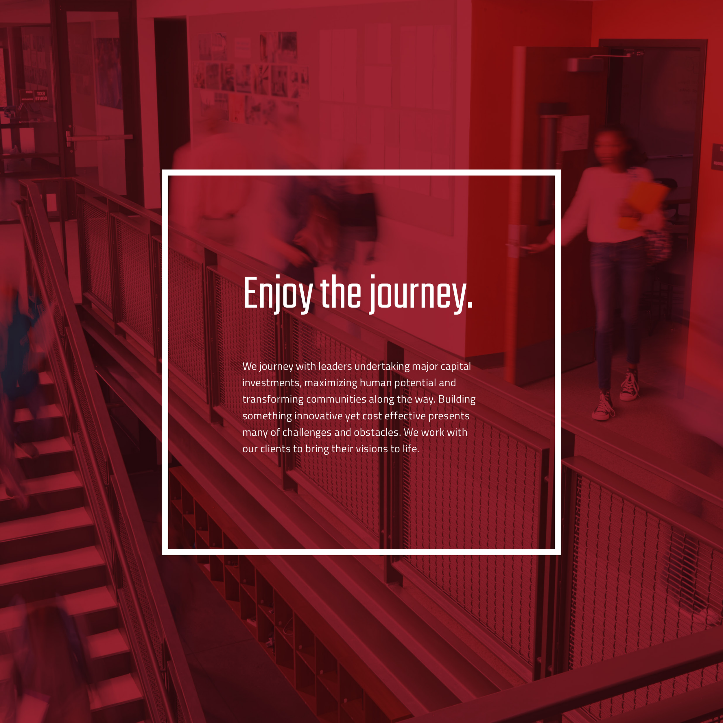 Blurry image of an indoor space with people walking and a sign that says 'Explore'