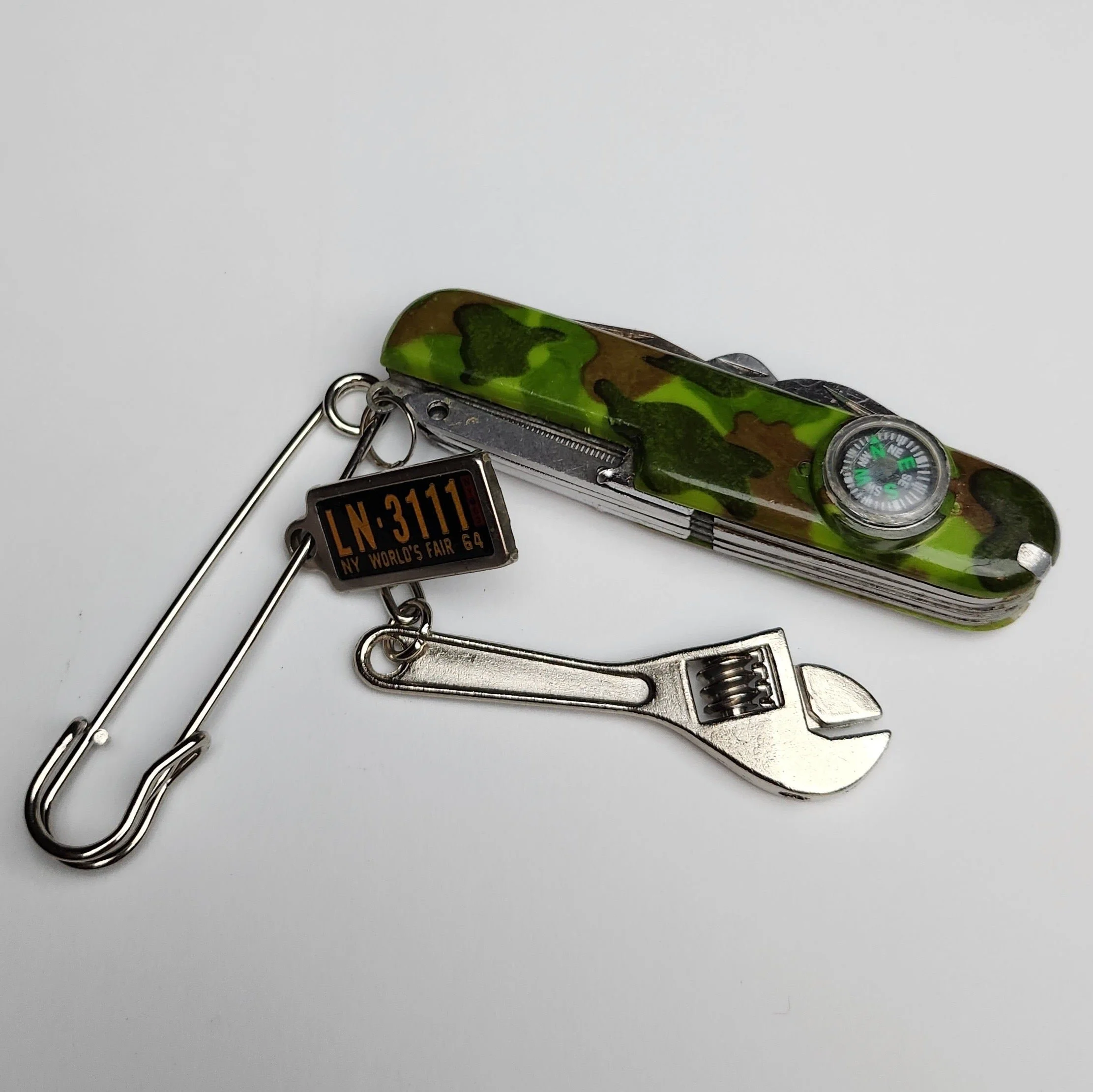 Steel safety pin with vintage pocket knife and charms (2023)