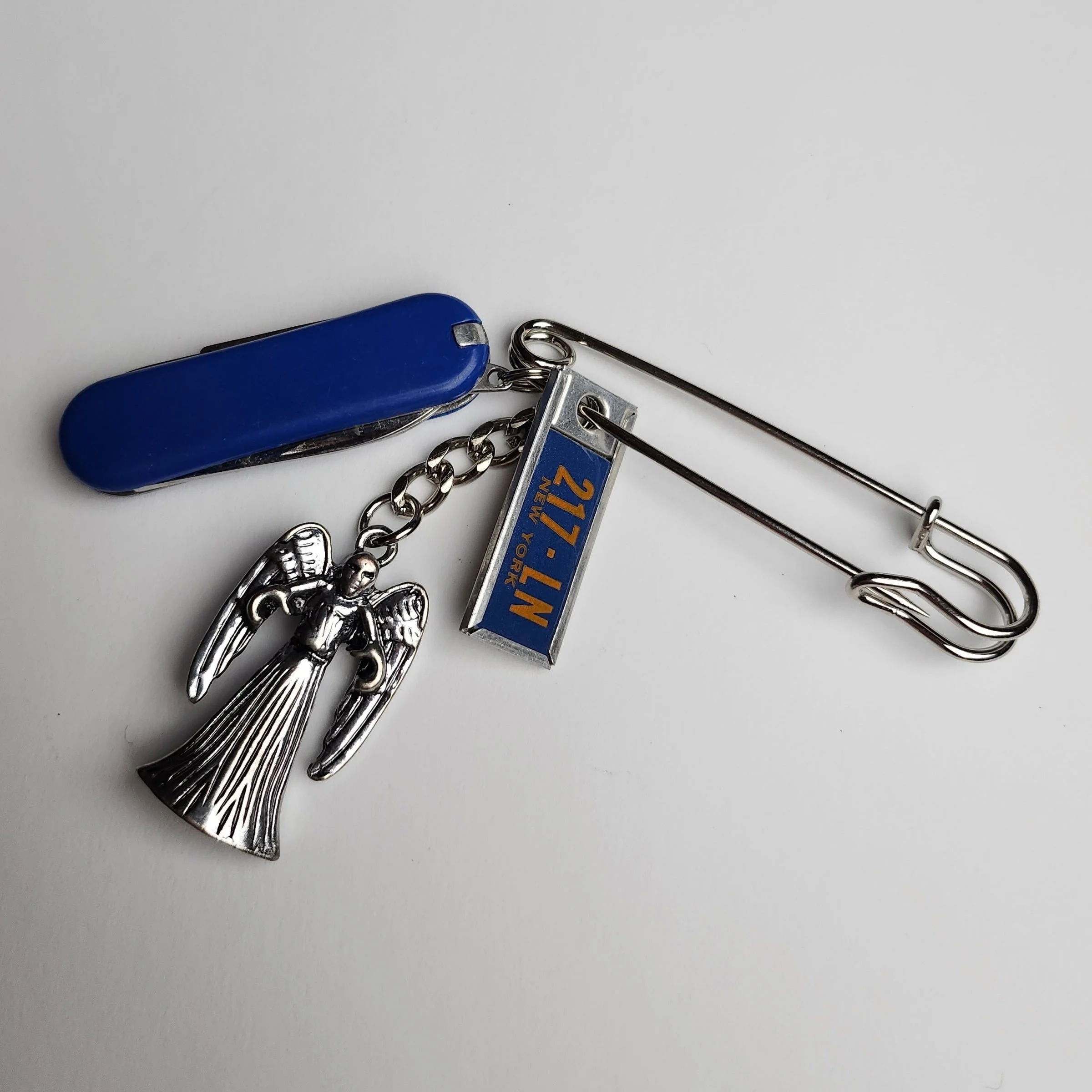 Steel safety pin with vintage pocket knife and charms (2023)