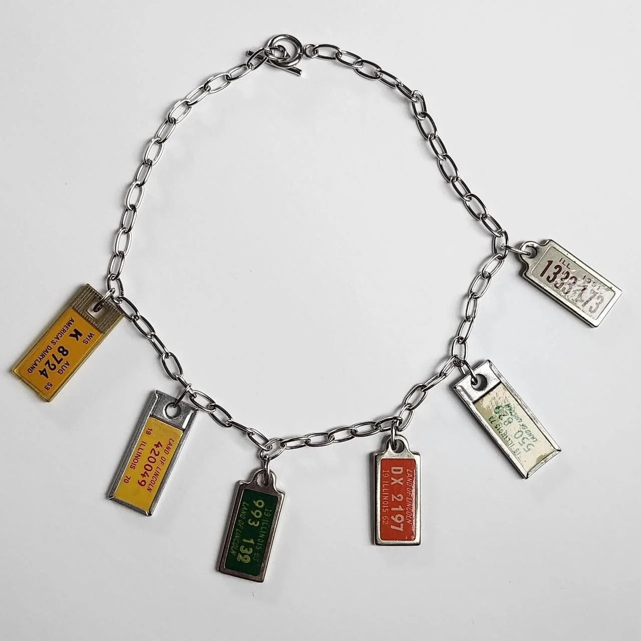 Steel chain and vintage license plate charms (2024)