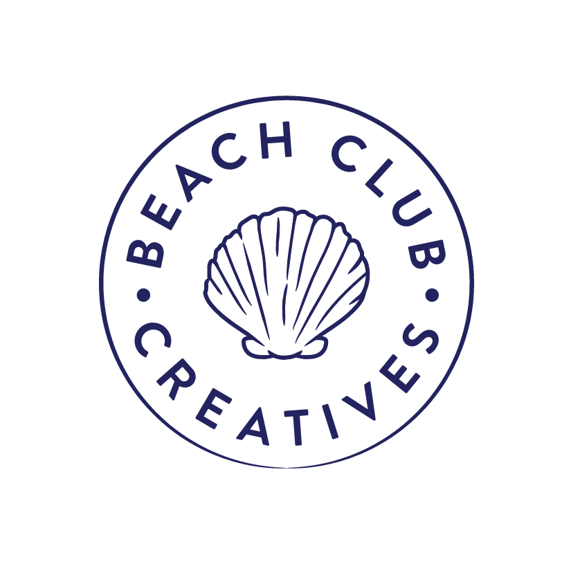 Logo of Beach Coach Club Creatives featuring a shell inside a circle with the text 'Beach Coach Club Creatives' around it.