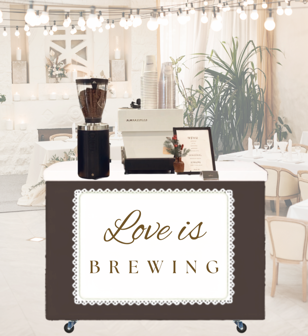 A mobile coffee or beverage station with a sign that reads 'Love is Brewing,' in a decorated event or wedding venue with tables, string lights, and candles.