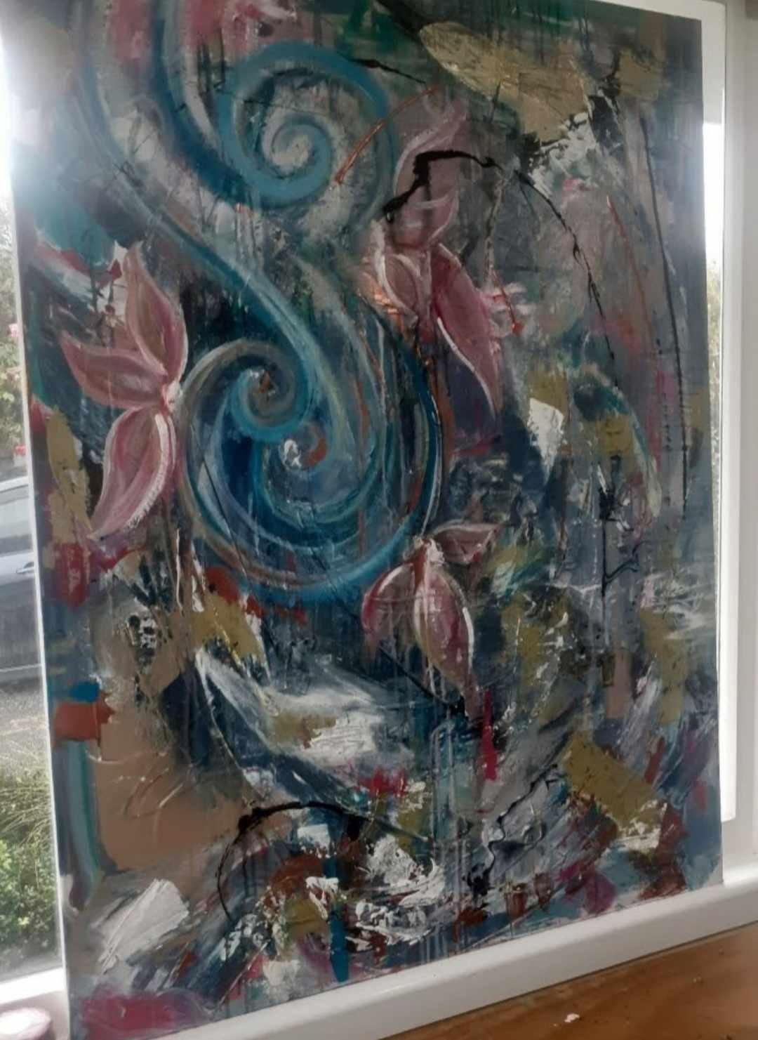 Abstract painting with swirling blue lines, pink leaves, and splashes of various colors.