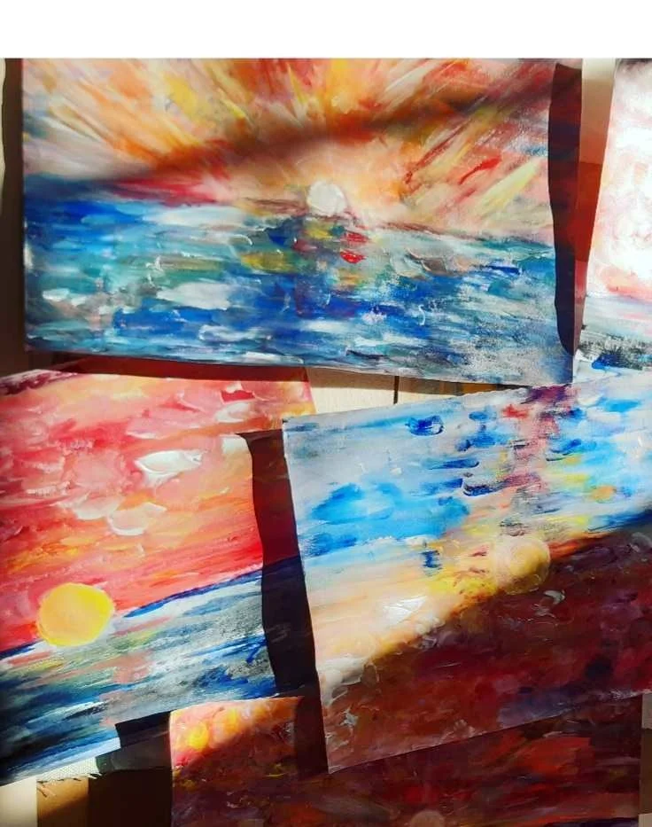 Multiple abstract oil paintings of sunsets over water, with vibrant colors such as orange, red, yellow, blue, and white.