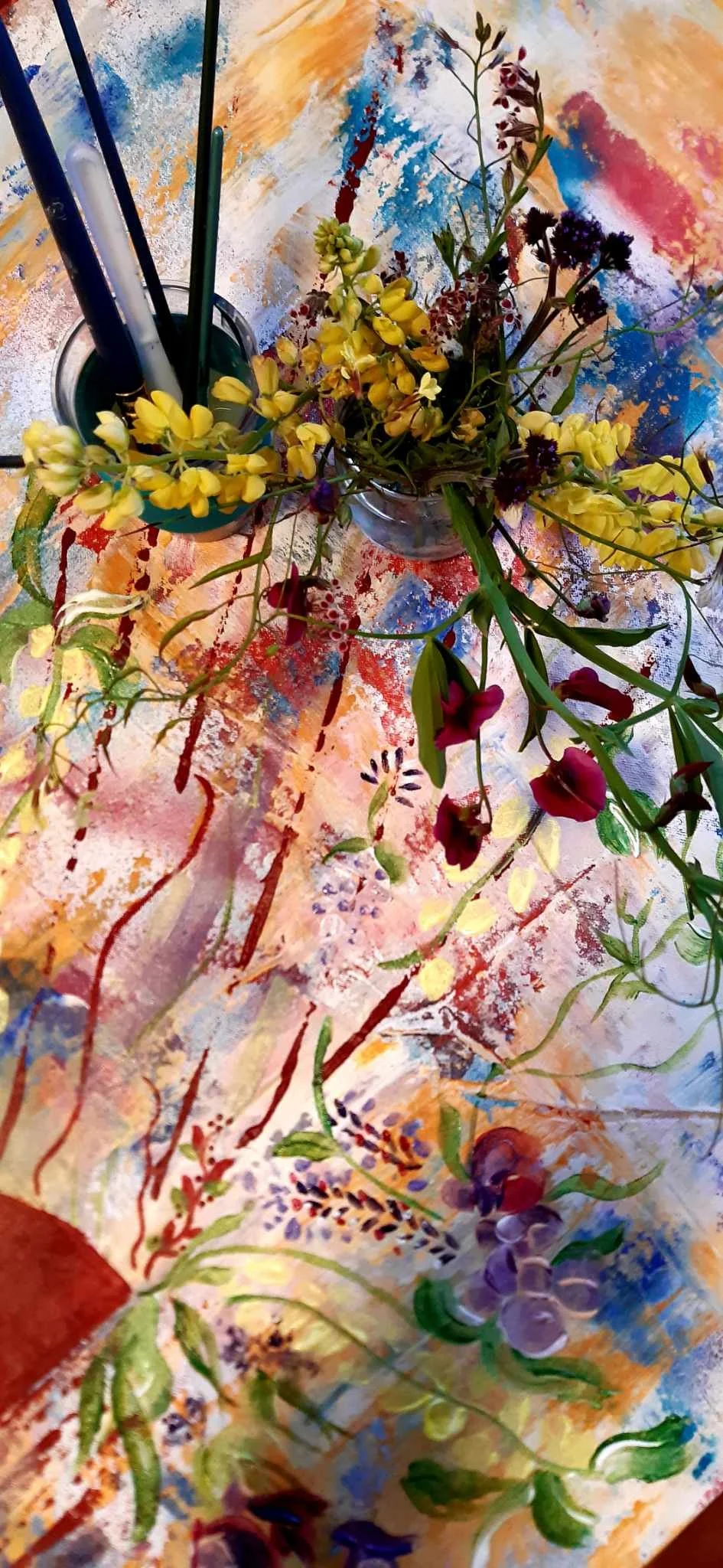 Drawings of flowers, leaves, and vines, with colorful abstract paint splashes on paper.