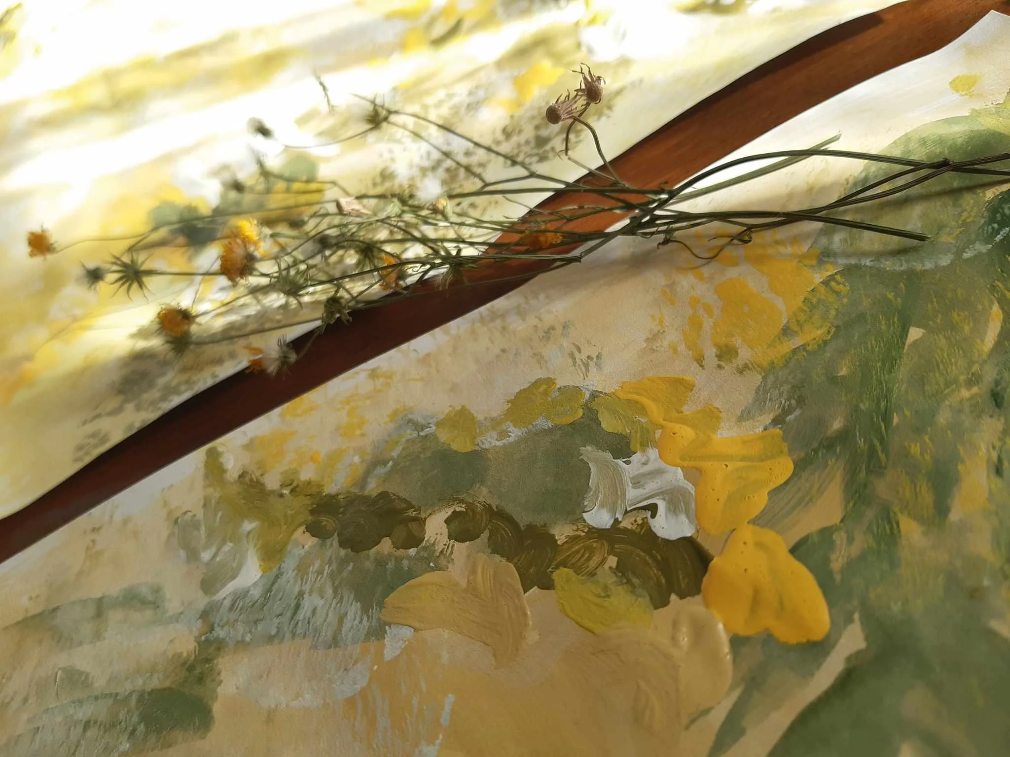 A still life painting of dried flowers and yellow flowers with a cloudy yellow and green background.