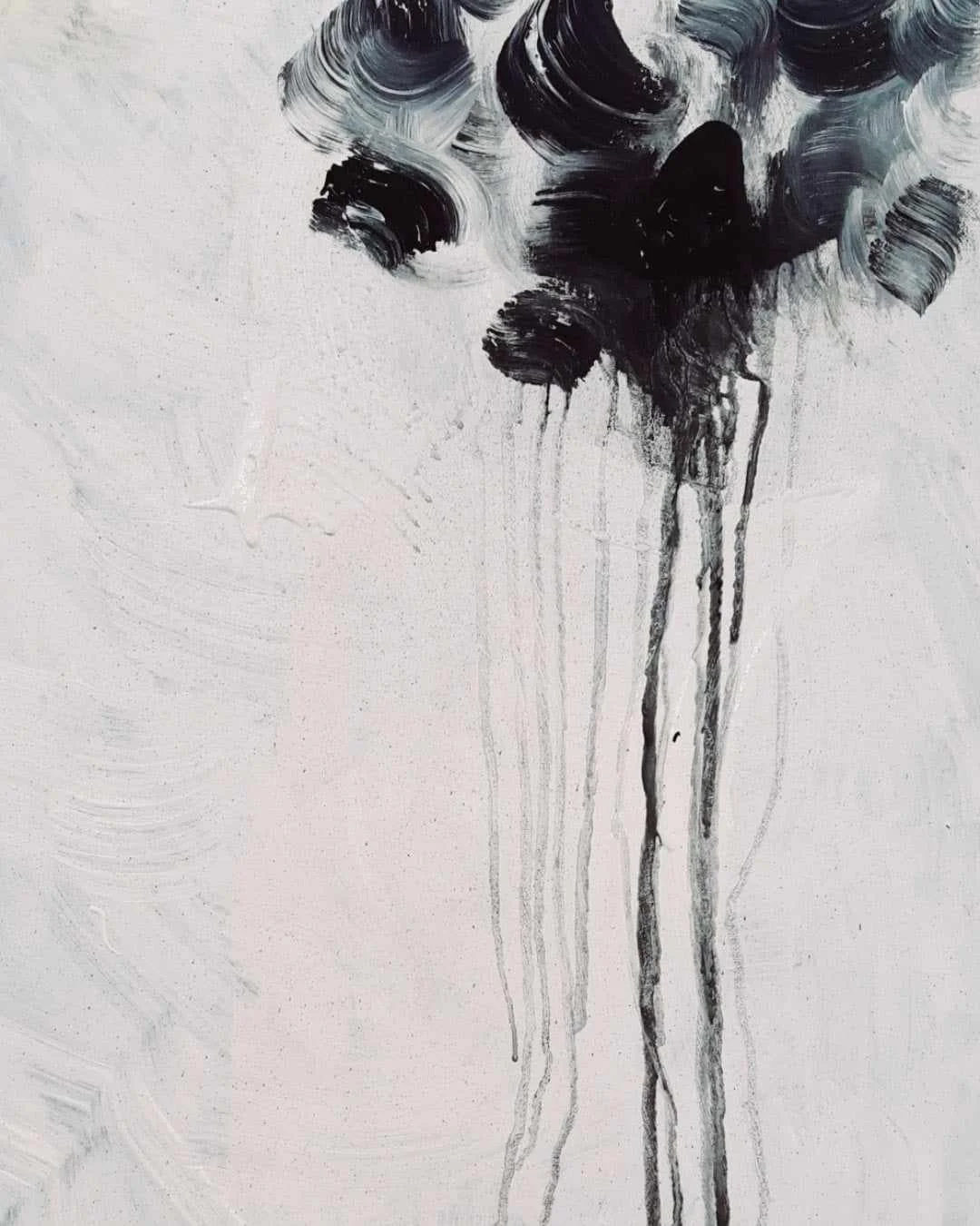 Abstract black and gray paint strokes on a white canvas, with drips running downward.