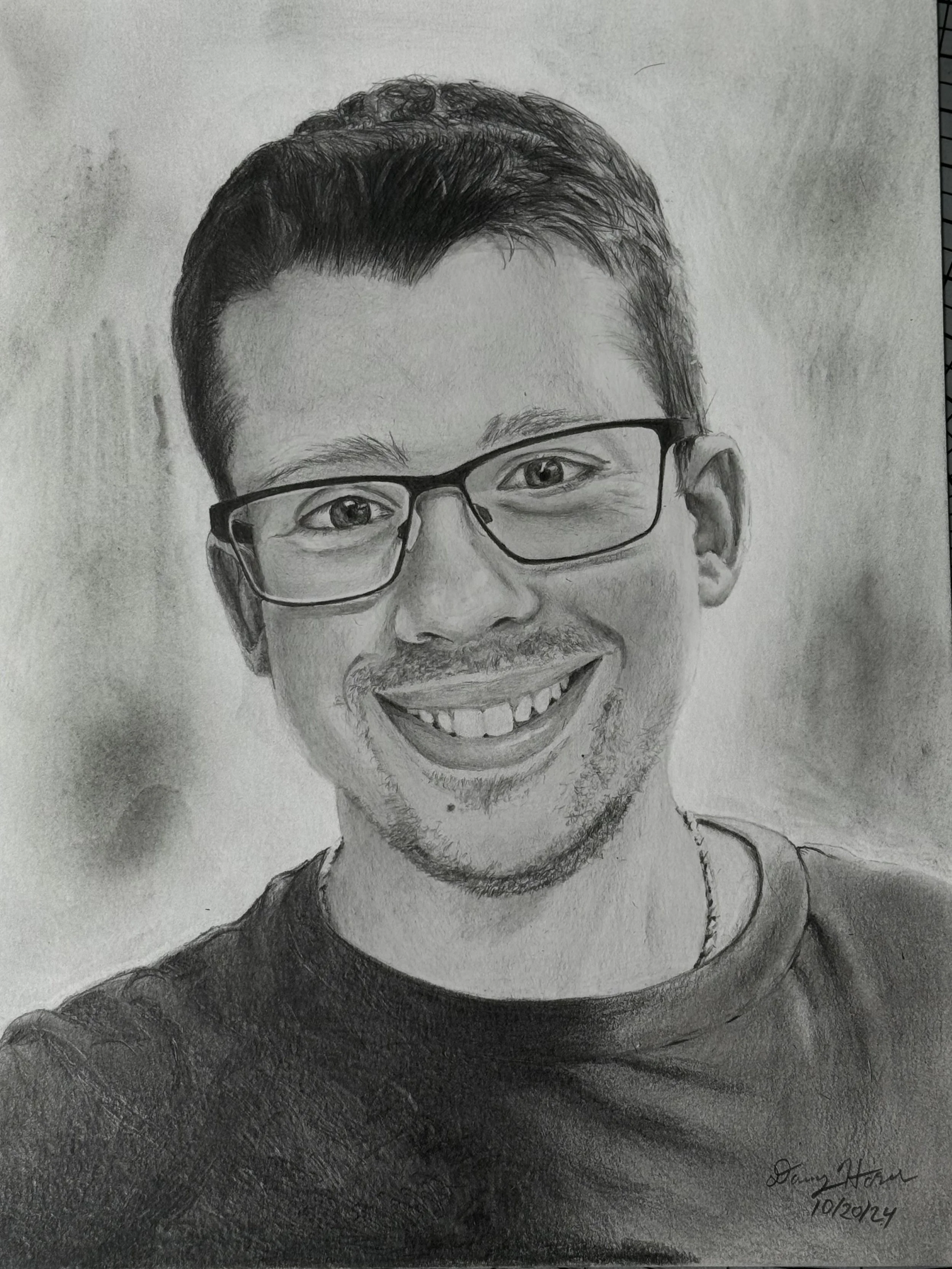 A black-and-white pencil sketch of a smiling man wearing glasses, with short, neatly styled hair and a shadowed background.