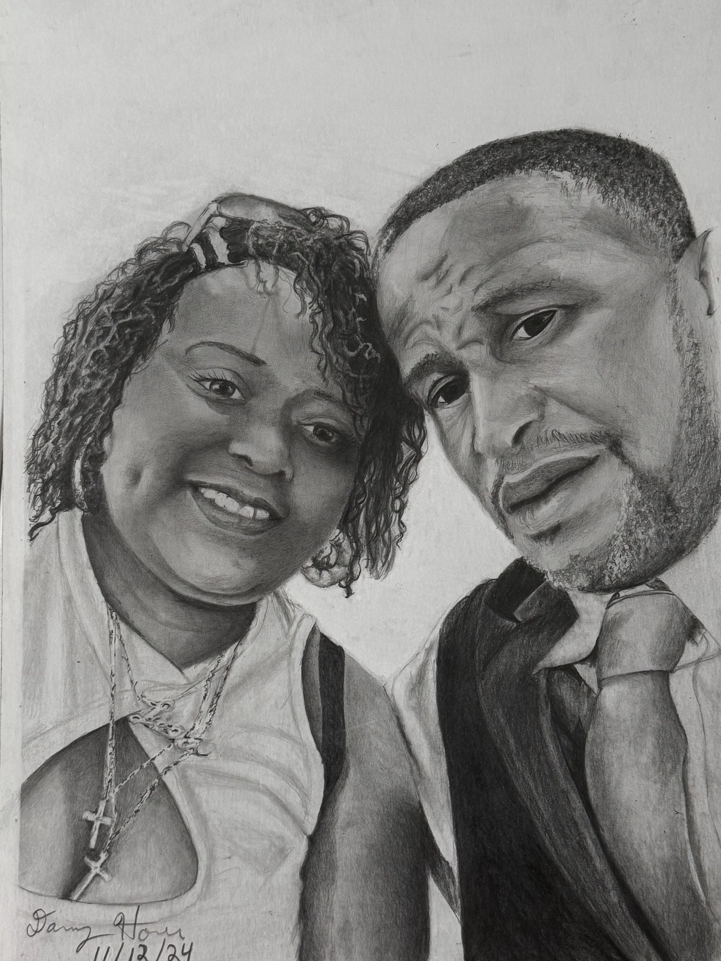 A realistic pencil sketch of a smiling woman with curly hair and a man with short hair, both posing closely for a selfie, with the woman's head slightly tilted and the man's face partially visible.