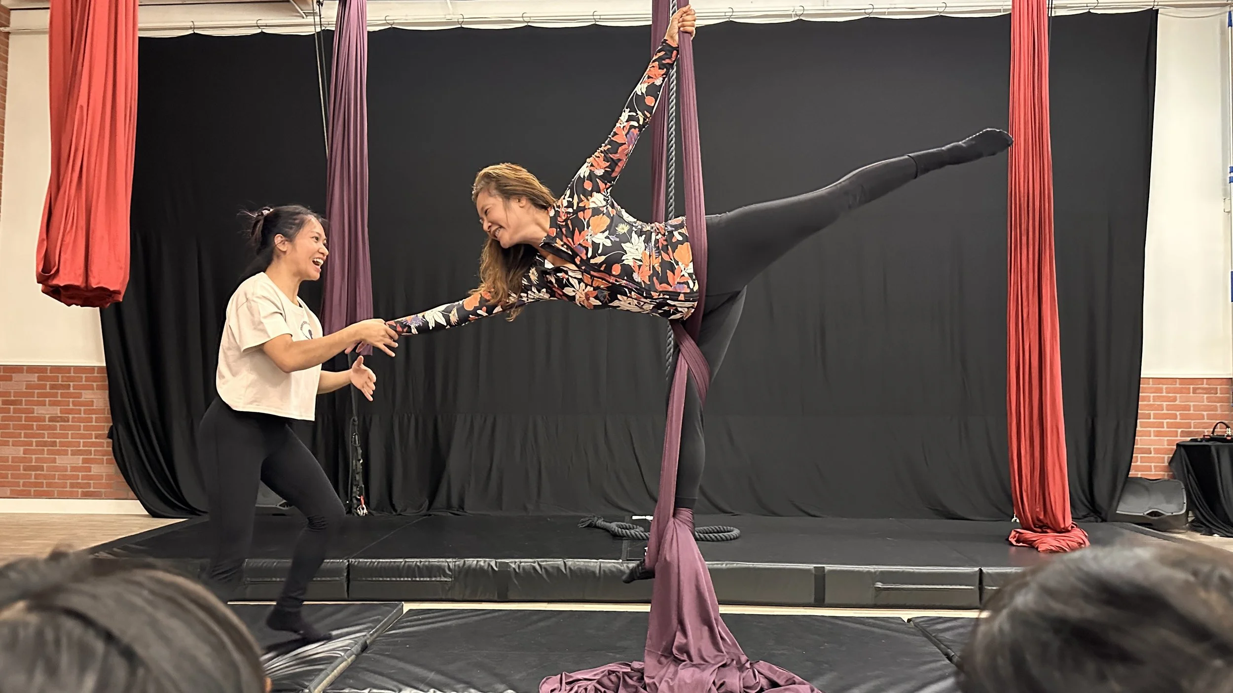 Beginner aerial student on aerial silks