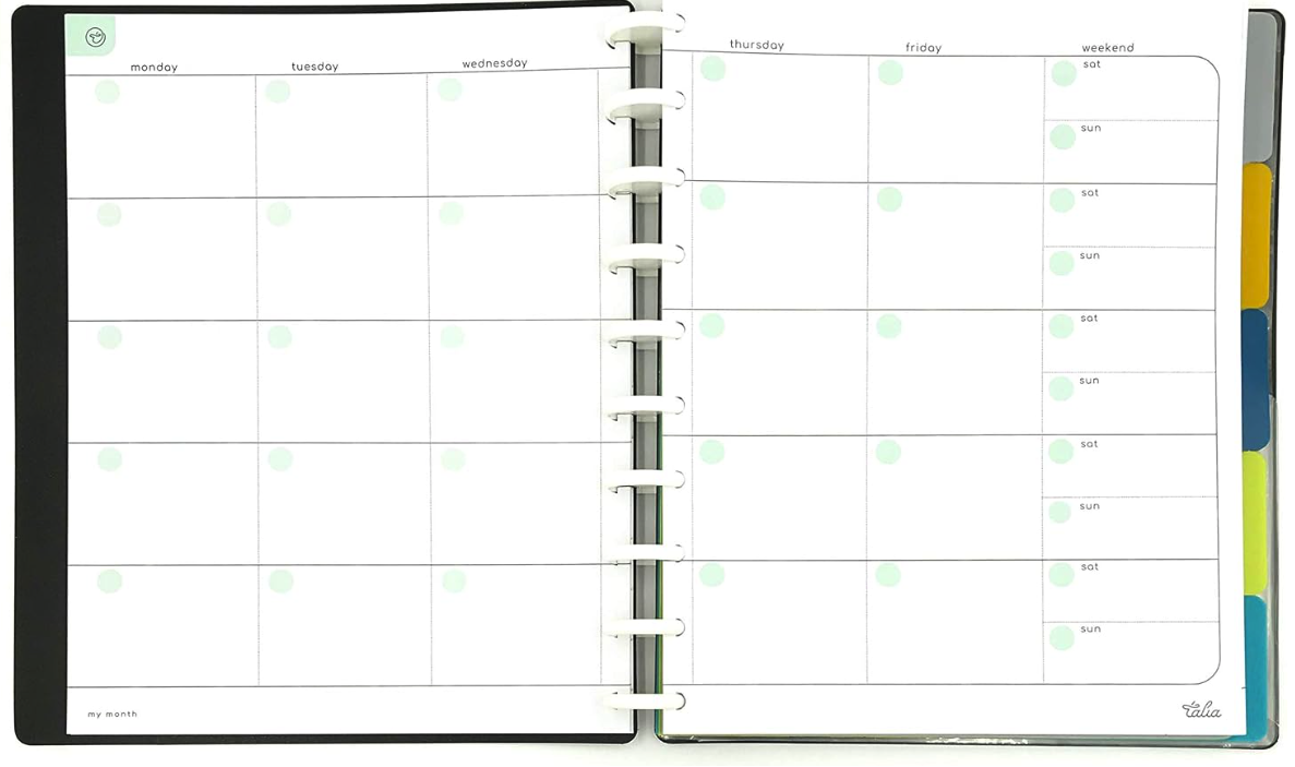 Open weekly planner with blank pages for each day of the week, including weekend, featuring green dots marking days, and colored tab dividers on the right side.