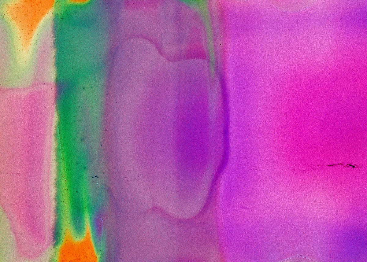 Abstract colorful smear with pink, purple, green, and orange hues blending together.