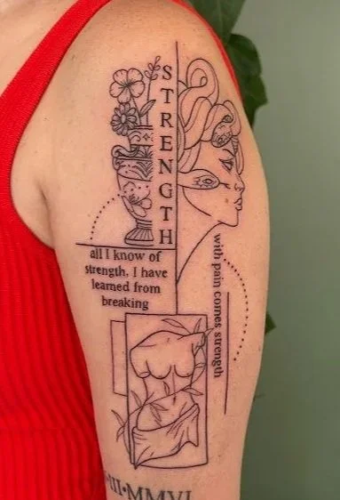 Tattoo on person's upper arm featuring a vertical cross with flowers, a woman's face profile, a cat, and a bed with a blanket, along with text about strength and resilience.