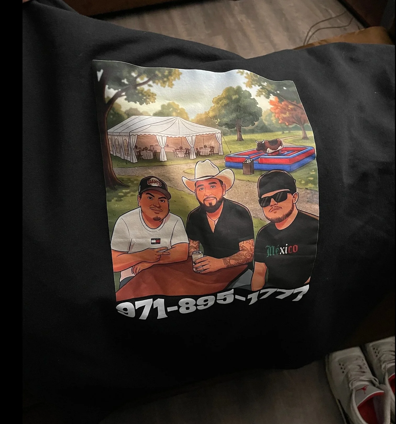 Graphic illustration of three men sitting at a table outdoors, with a large white event tent and trees in the background, and a cow on an inflatable pool. The men are holding drinks, and one is wearing a baseball cap, another a cowboy hat, and the third sunglasses. There is a phone number at the bottom of the graphic.
