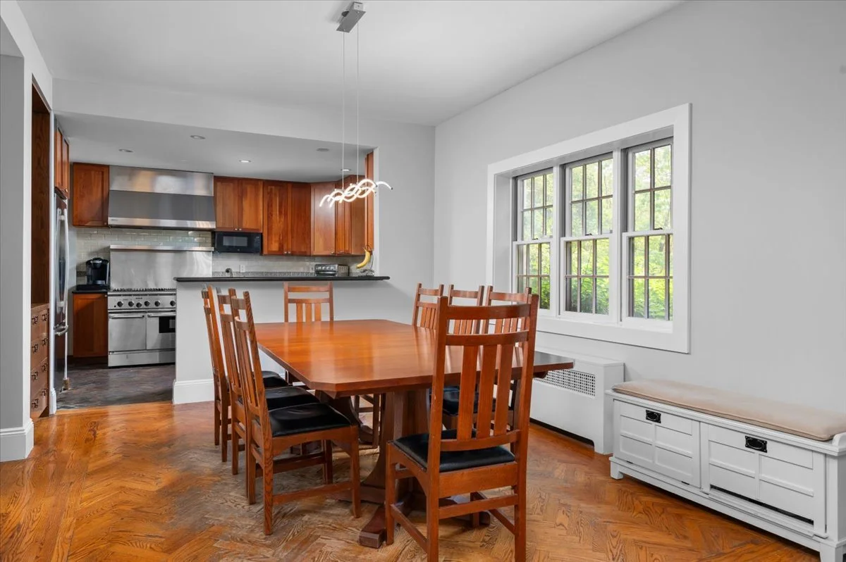 Formal dining room with Eastern and Western exposures, opens to kitchen and living room