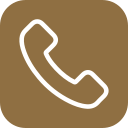 Icon of a white telephone receiver on a brown circular background.