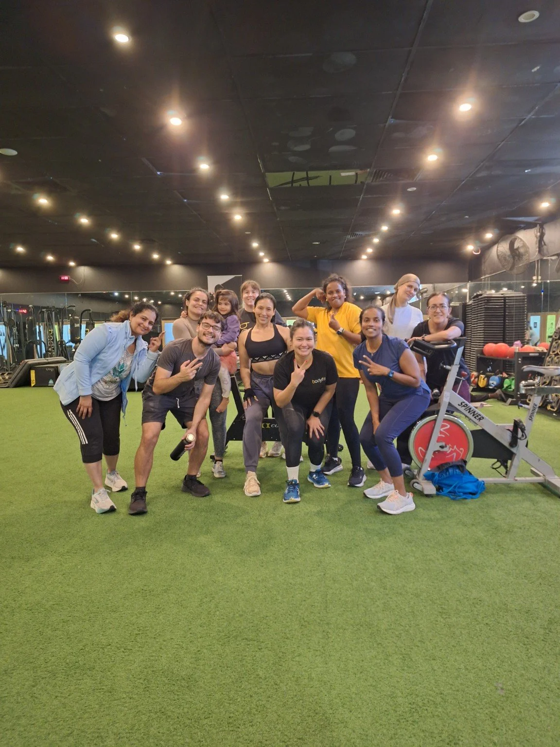 Members celebrating after group fitness class led by Vera Yazid