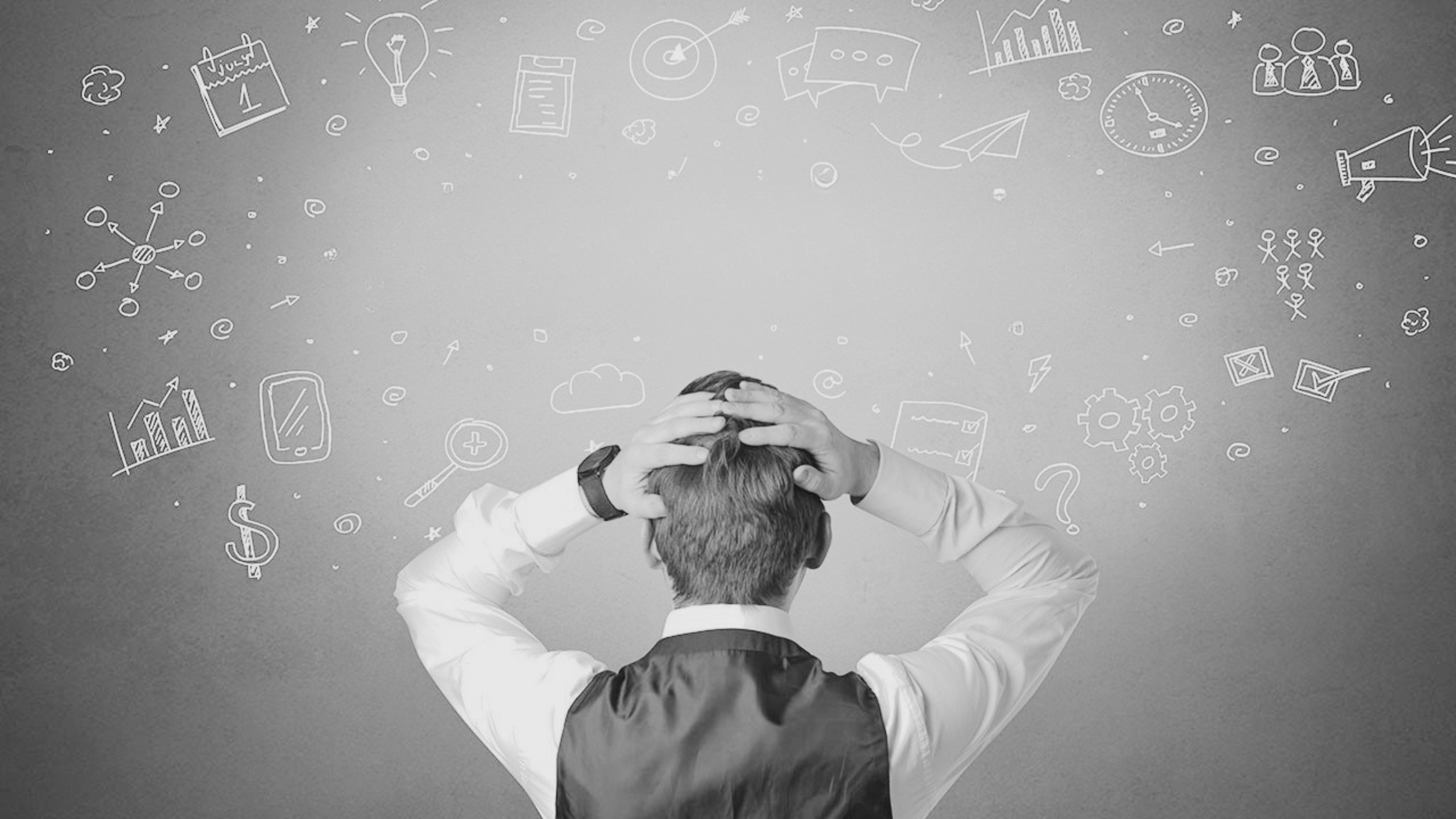 A man in a white shirt with a black vest, seen from behind, holding his head with both hands, standing in front of a gray background with various white doodles of charts, graphs, a calendar, a lightbulb, a mobile phone, and other symbols related to business and ideas, indicating stress or frustration.