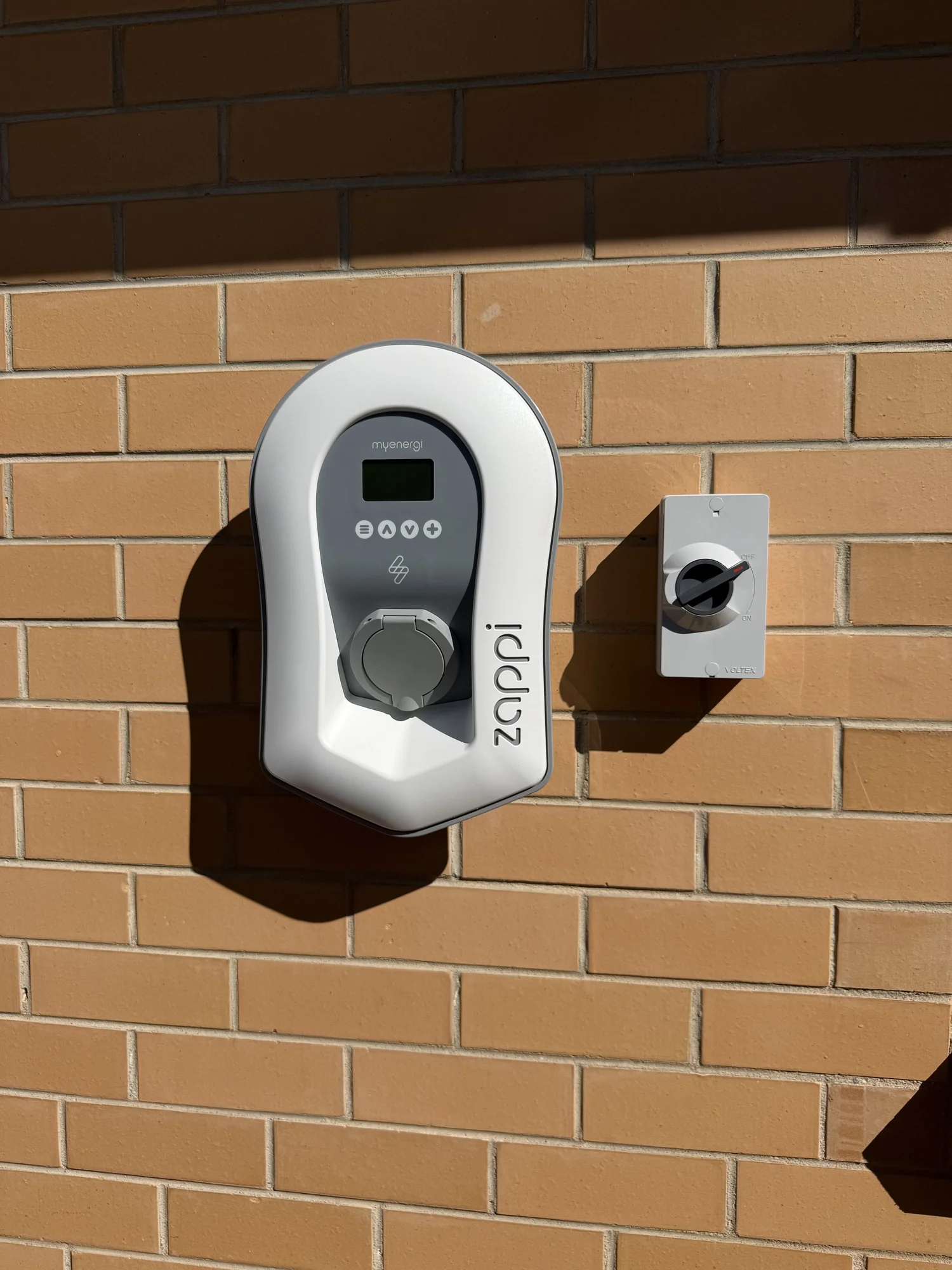 Wall-mounted Zappi EV charger installed at a residential property by Connect Electrical & Solar