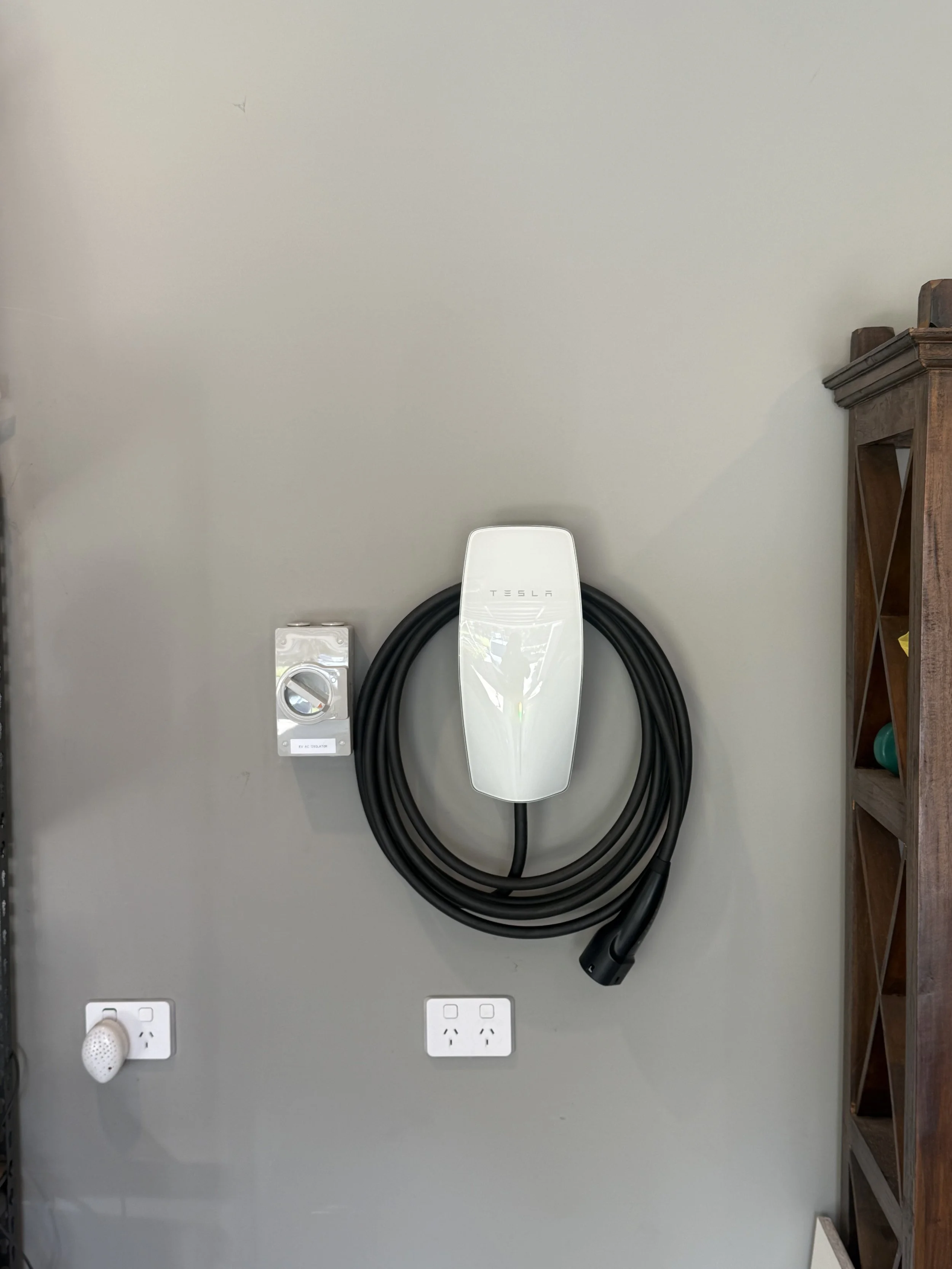 Tesla home EV charger installed at a residential property by Connect Electrical & Solar