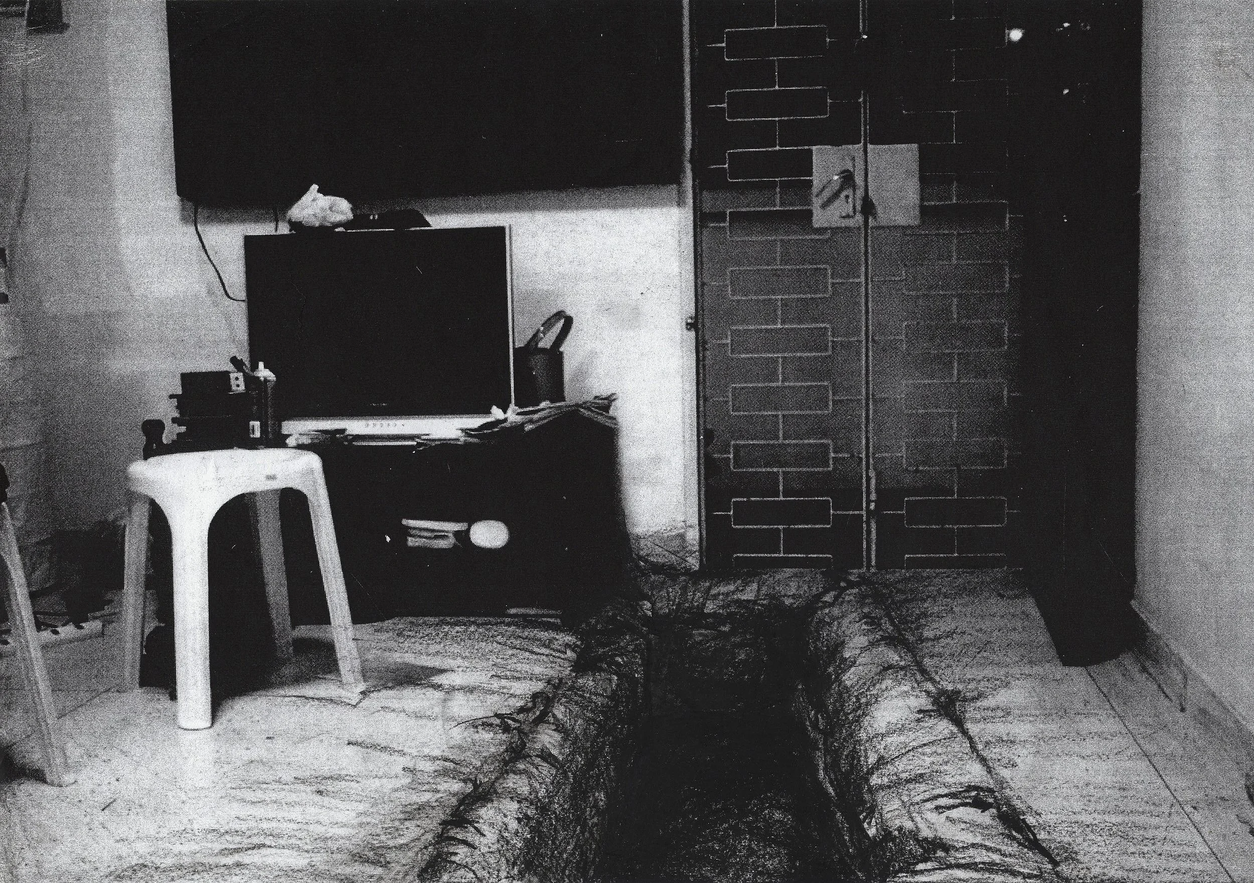 Stark black and white collage of a bare-boned living room in a home in Singapore with a drawing of a war trench dug into the floor.