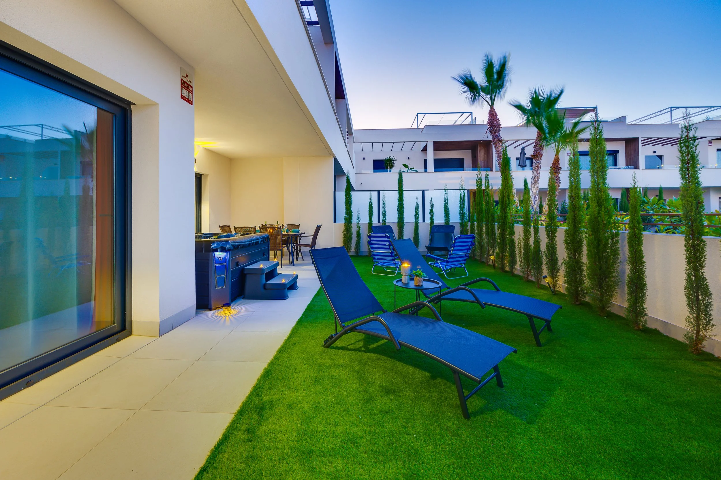 Relax in your private garden with sun loungers and a hot tub.