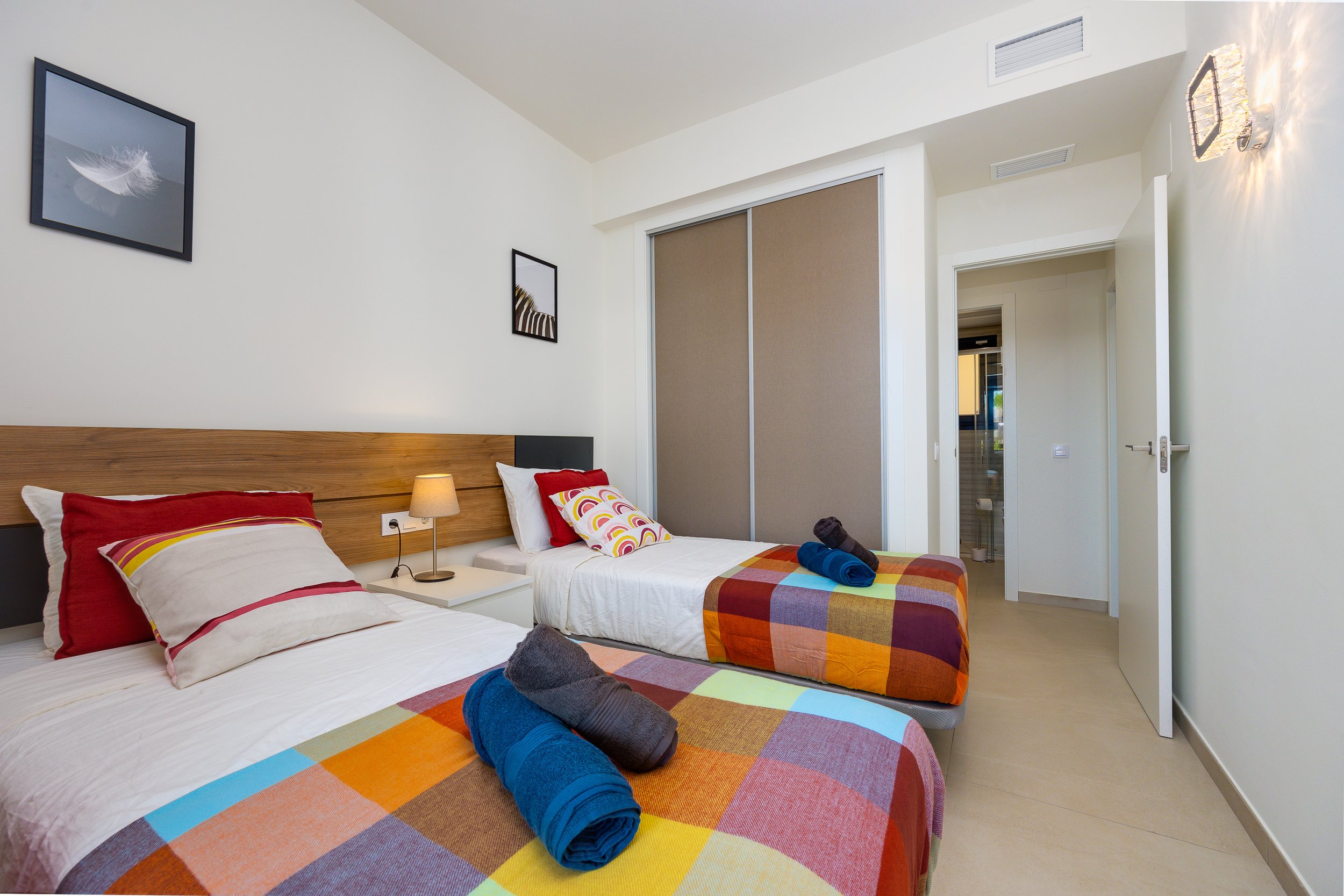 The guest bedroom enjoys direct access to the garden and terrace.