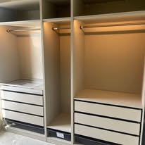 Empty closet with shelves and hanging rod