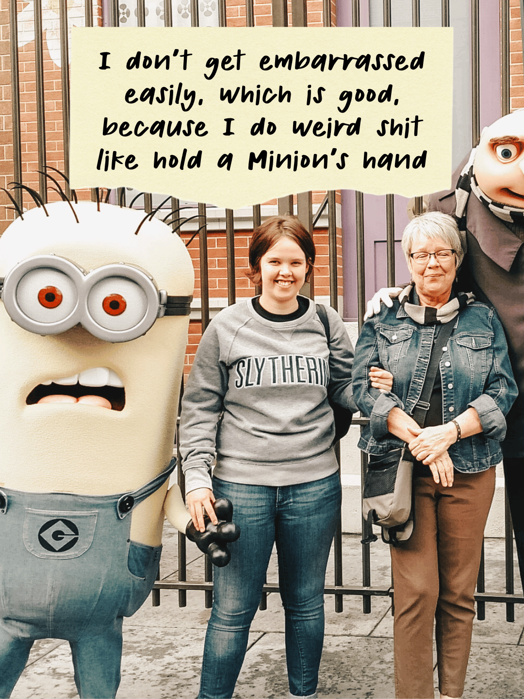 Photo of Marin and her mom at the Universal Studios Minions ride. Marin is holding the Minion's hand. The text says, "I don't get embarrassed easily. Which is good, because I do weird shit like hold a Minion's hand." 