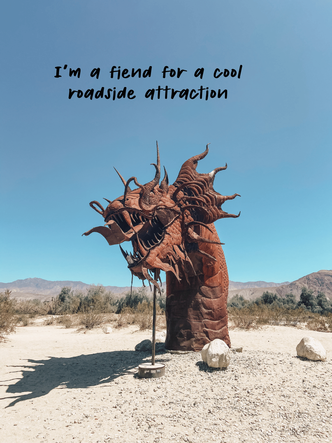 Photo of the dragon metal sculpture at Anza-Borrego State Park. The text says, "I'm a fiend for a cool roadside attraction." 