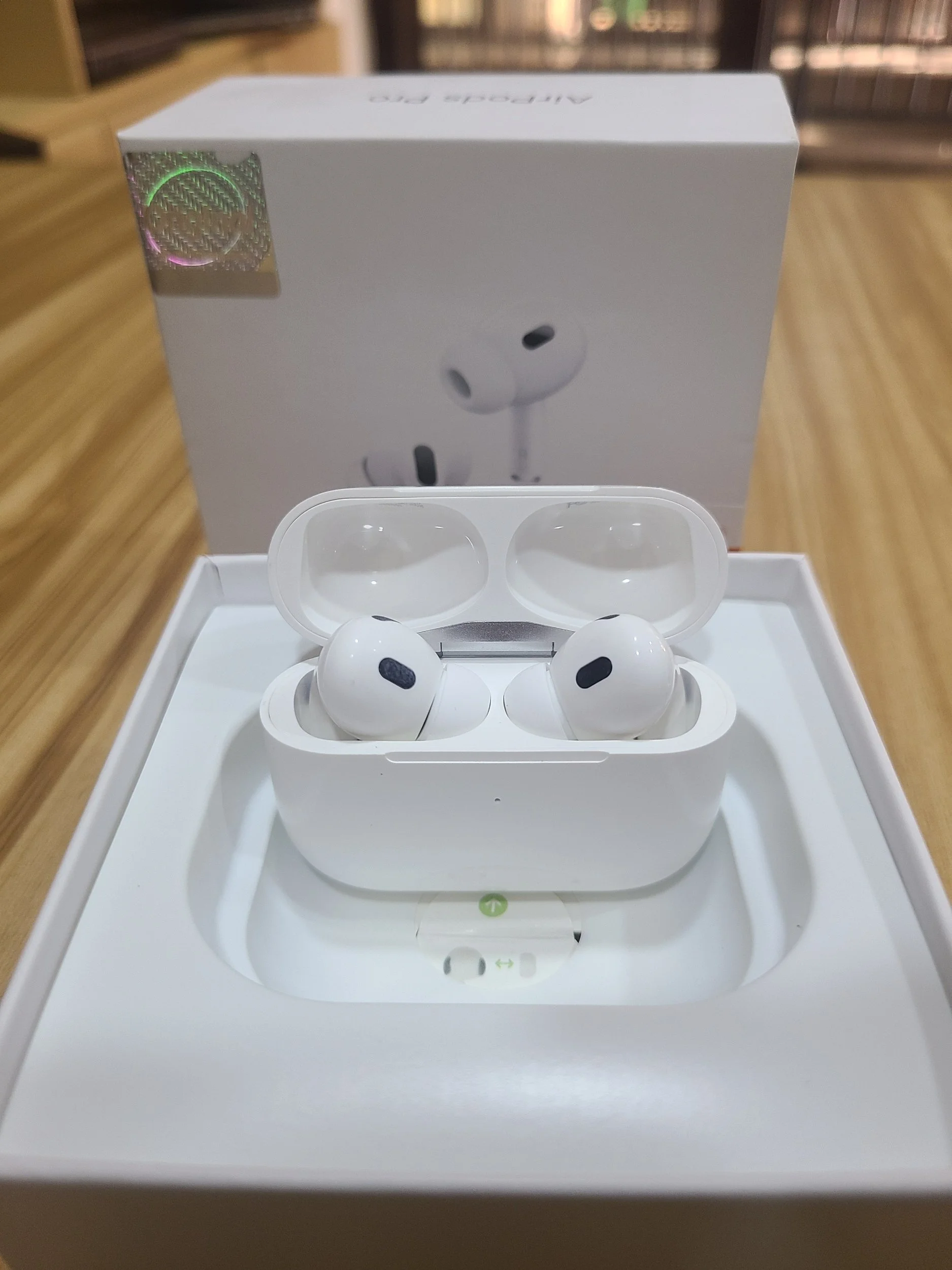 Wireless earbud kit including white charging case, lightning to USB-C cable, and replacement ear tips.