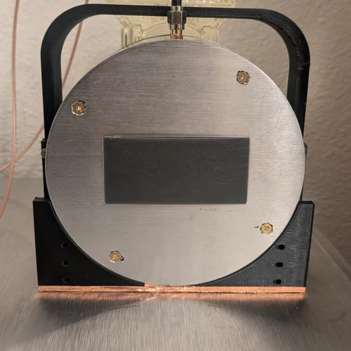Assembled ACME Double-Barrel magnet with sample bottle attached