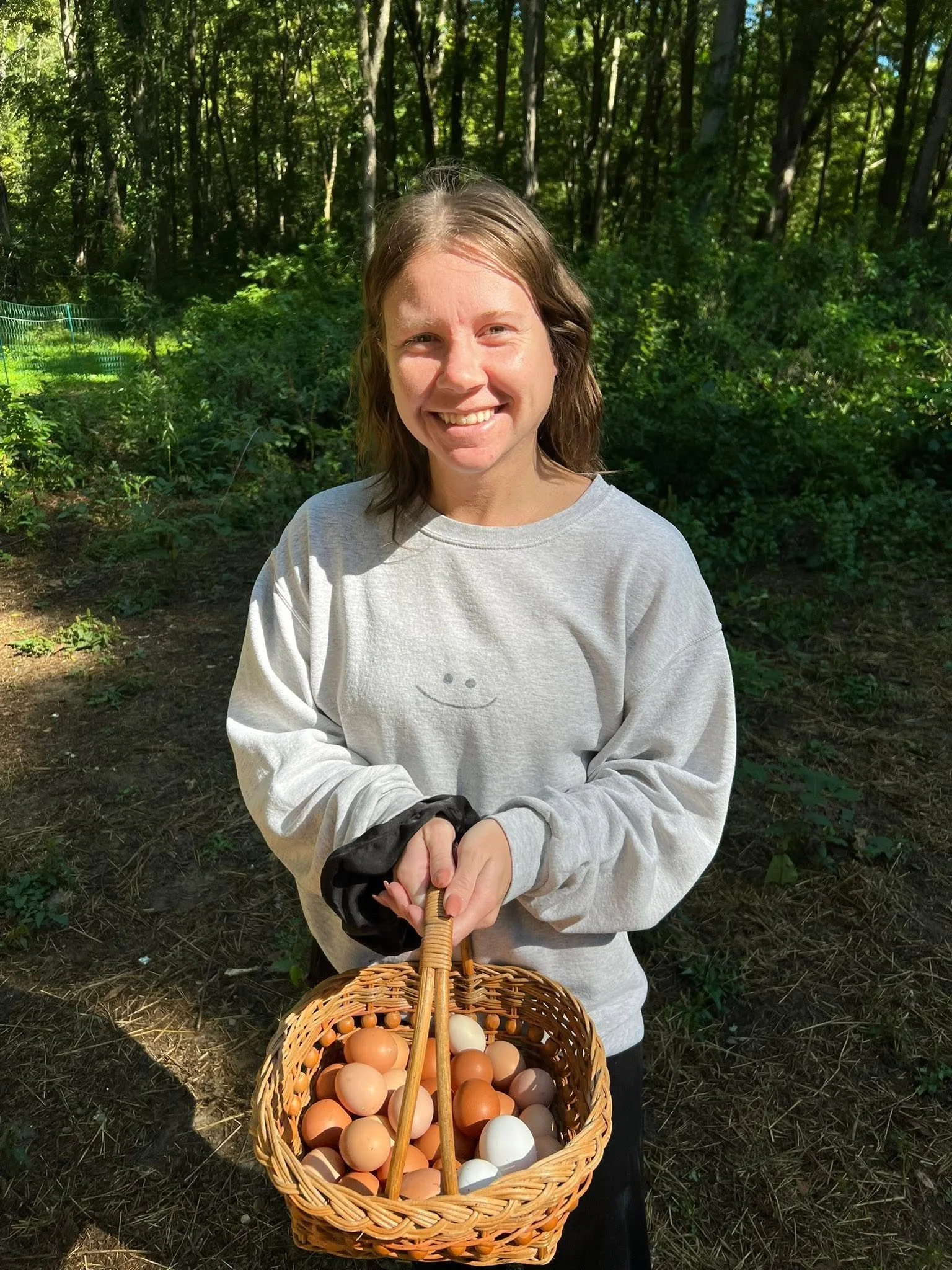 Fresh eggs and a happy farmer, Paige showing off one of the day’s hauls.