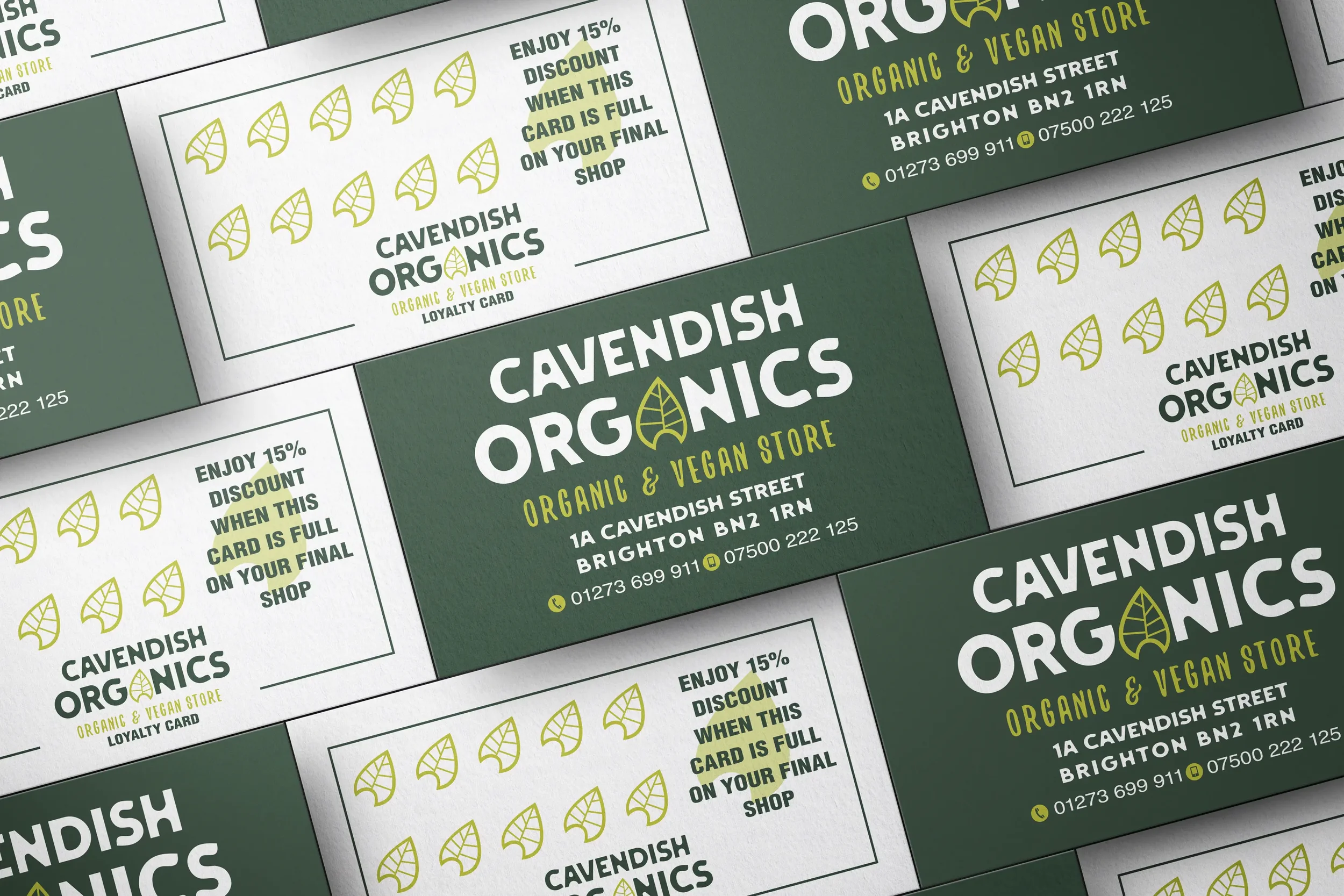 Multiple loyalty cards for Cavendish Organics, an organic and vegan store, showing the store's logo with a leaf design, store address, and contact information.