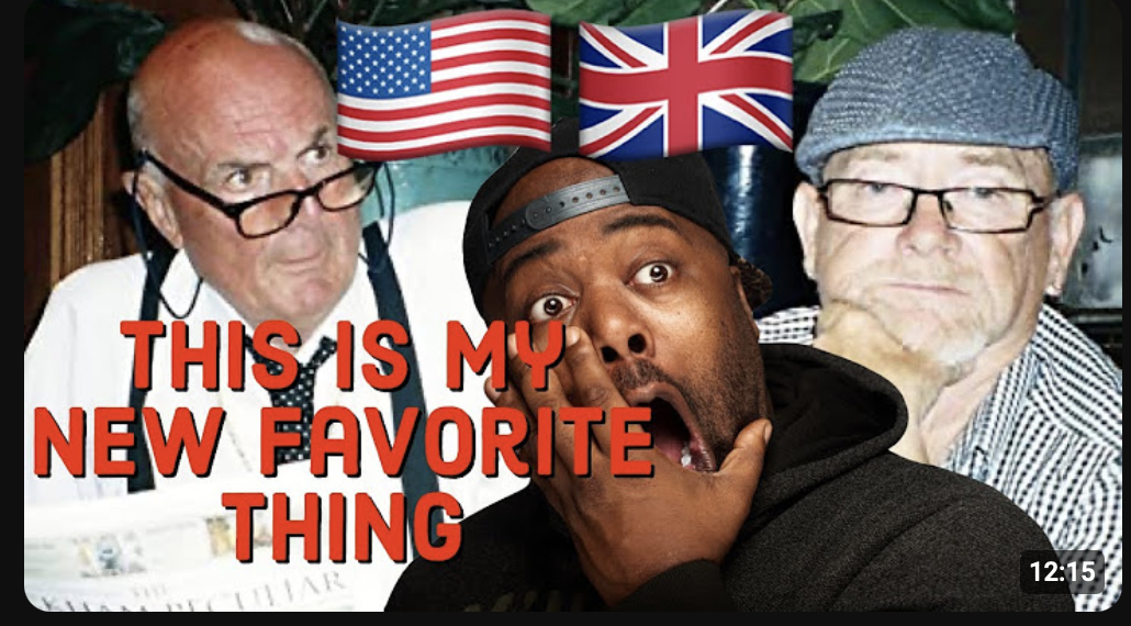 A man in the foreground looks surprised, covering his mouth with his hand, while two older men in the background sit at a table, one with glasses and a beard wearing a flat cap, and the other with glasses and a bow tie. Flags of the United States and the United Kingdom hang behind them. The text overlay says, "This is my new favorite thing."