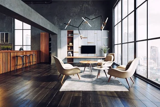 Modern living room with large windows, minimalist furniture, and a media unit with a TV