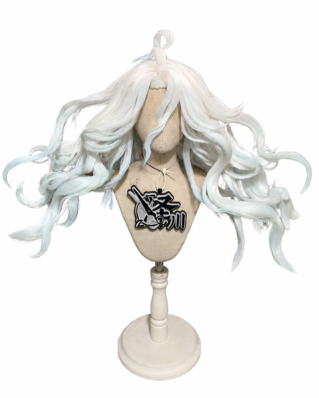 Wig on a mannequin with a face cover, featuring long, white curly hair with light blue streaks and a black and white necklace.