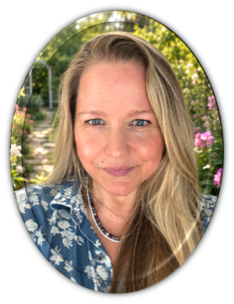 Author Stephanie Smeenk smiling outdoors in a garden.