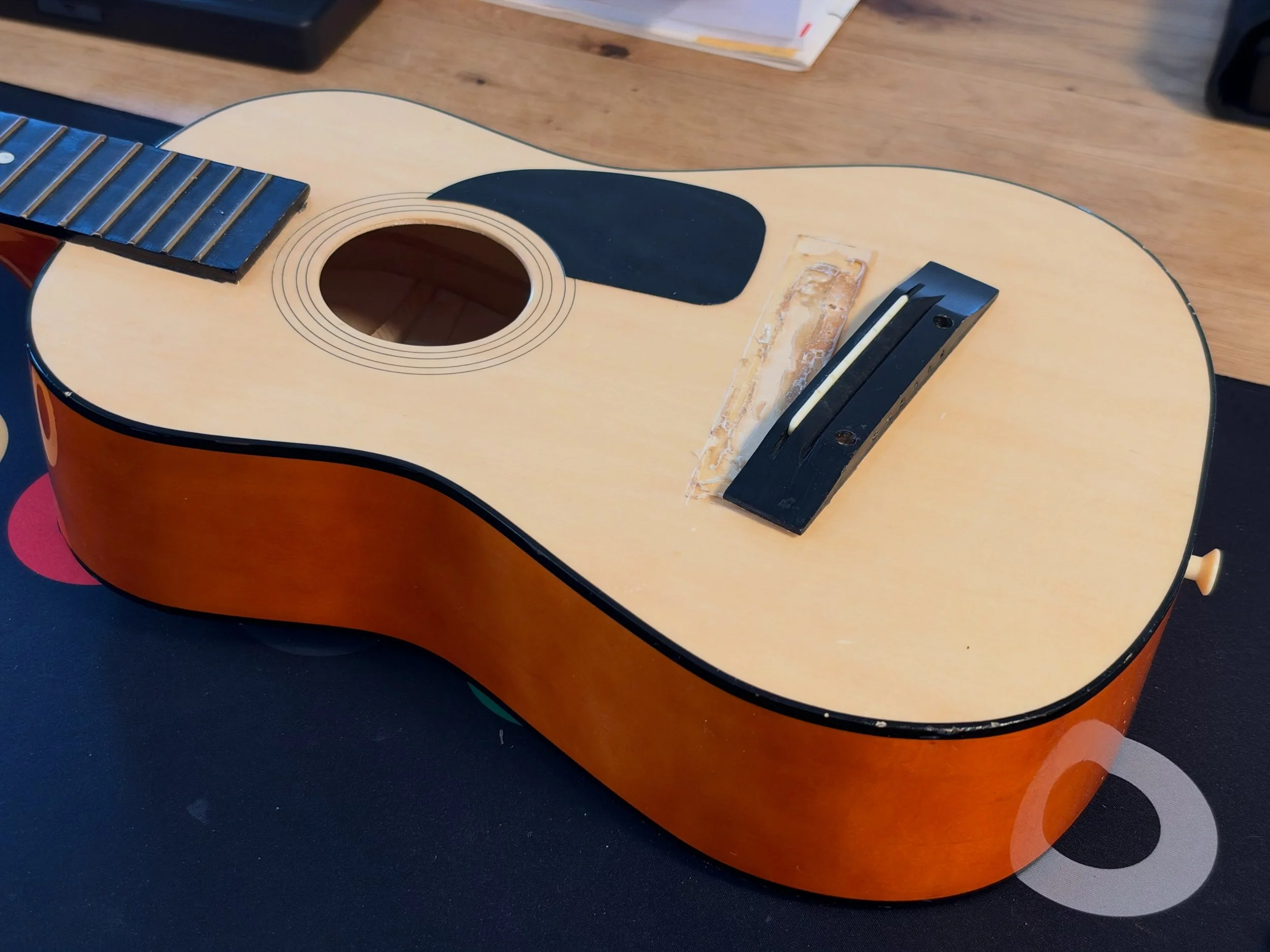 Rainy Sunday. I love days like this. It makes me miss Boston and having less responsibility.
I finished my most important job to date - fixing my kid&rsquo;s guitar. When my kid found it broken (bridge raised from the body and the soundboard broken) 