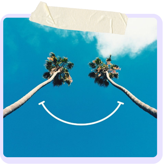 Two palm trees against a blue sky with a smiley face drawn between them.