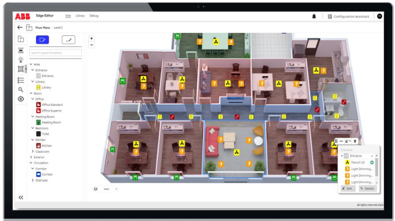 Digital floor plan of an office building on a computer screen, showing multiple rooms including reception, offices, meeting rooms, and restrooms with icons for security and lighting controls.