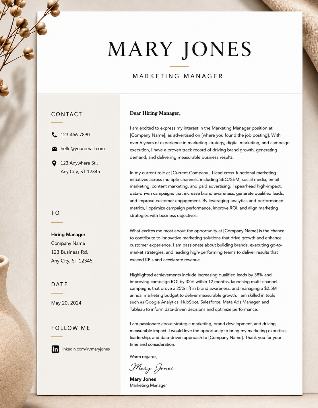 A professional resume or cover letter for Mary Jones, a marketing manager, printed on white paper with contact information, date, and social media link on the left, and a formal letter on the right. The document is on a light background with decorative dried plant stems and a cloth visible around it.
