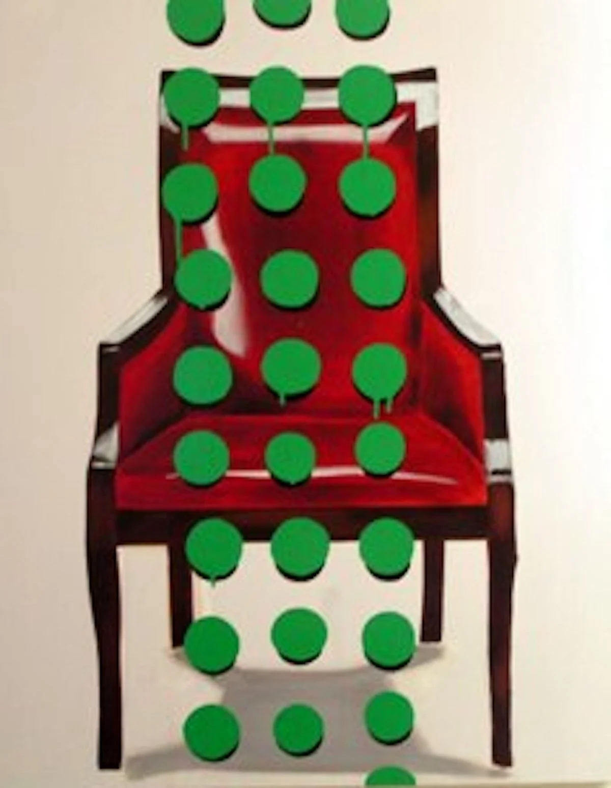 Red wooden chair with green dots arranged on and around it.