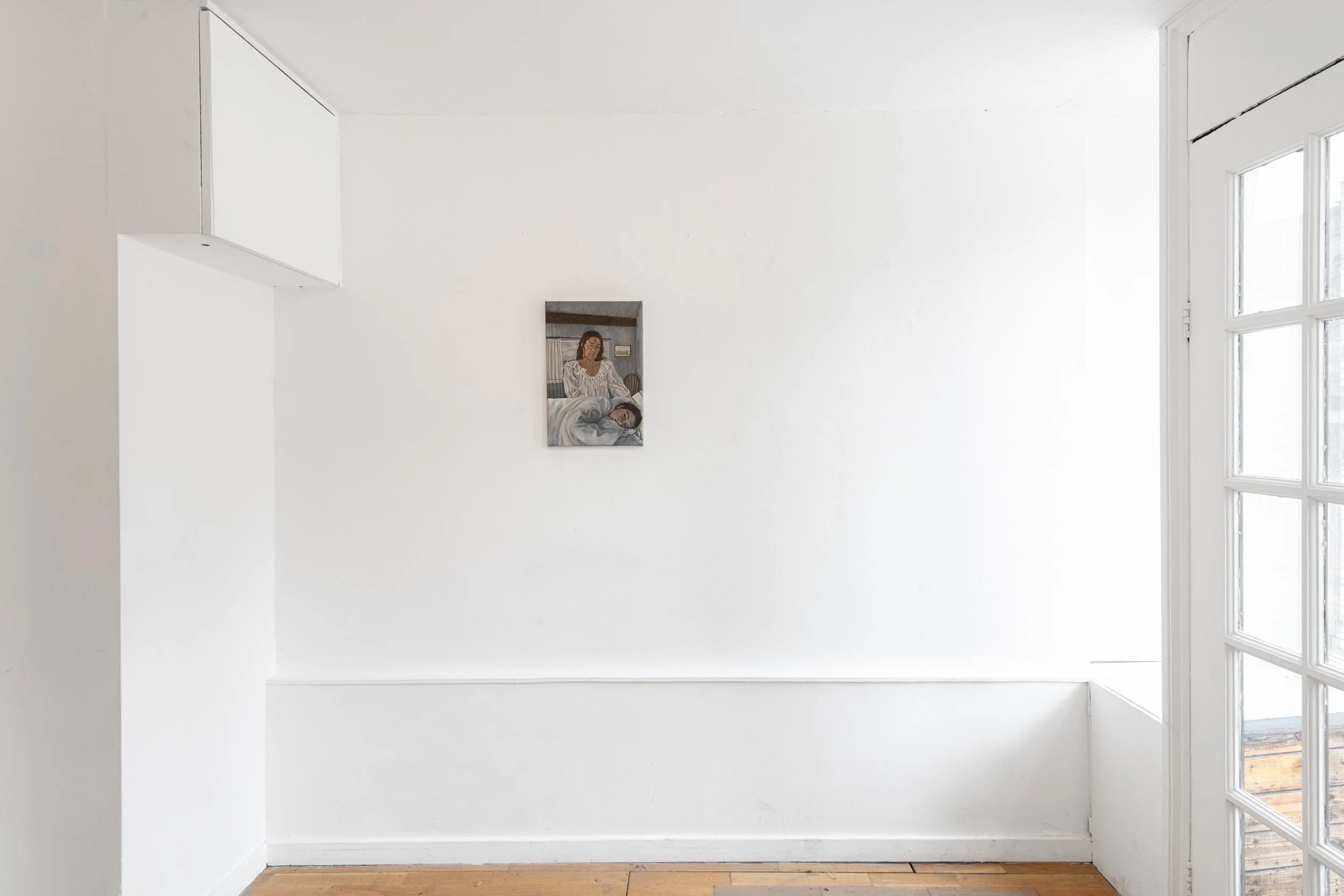 A white gallery wall with a small painting of a woman sitting on a bed accompanied by a small dog, next to a large window with multiple panes.