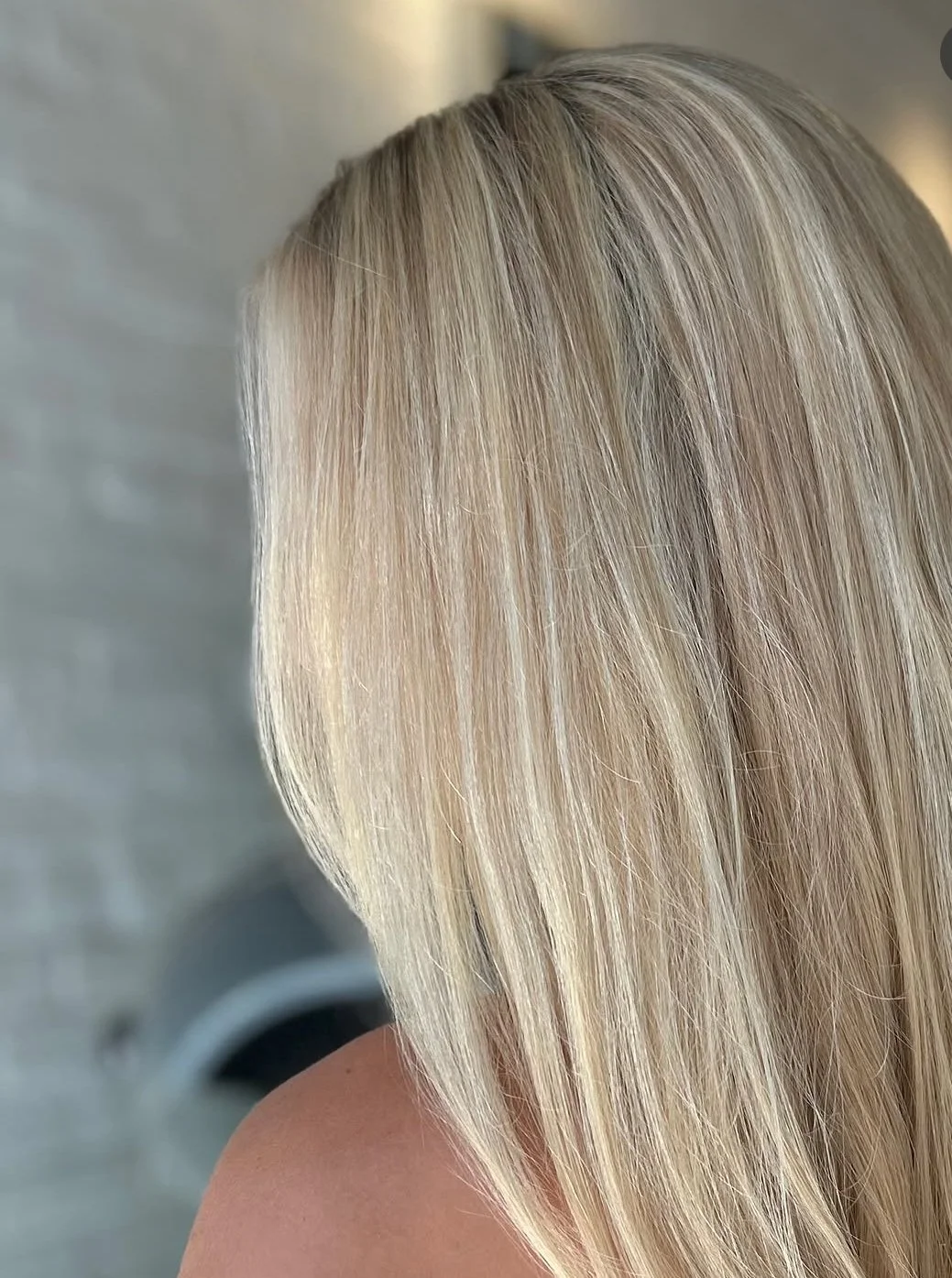 Close-up of a woman with straight, blonde hair.