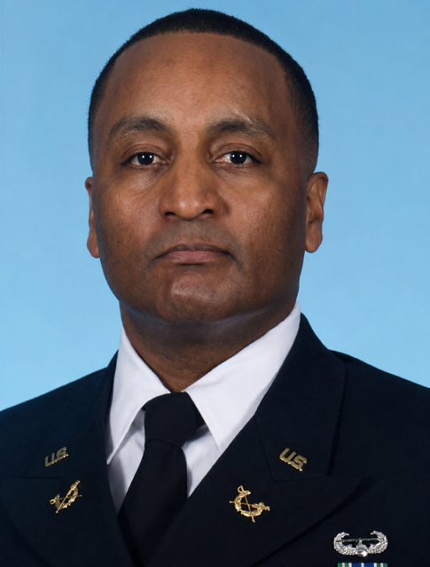 Portrait of a man in a U.S. military dress uniform against a blue background.