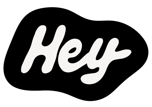 White handwritten-style “Hey” lettering on a black background