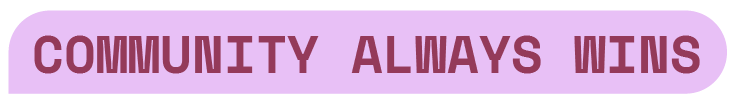 Banner reading “COMMUNITY ALWAYS WINS” in maroon text on a light purple background.