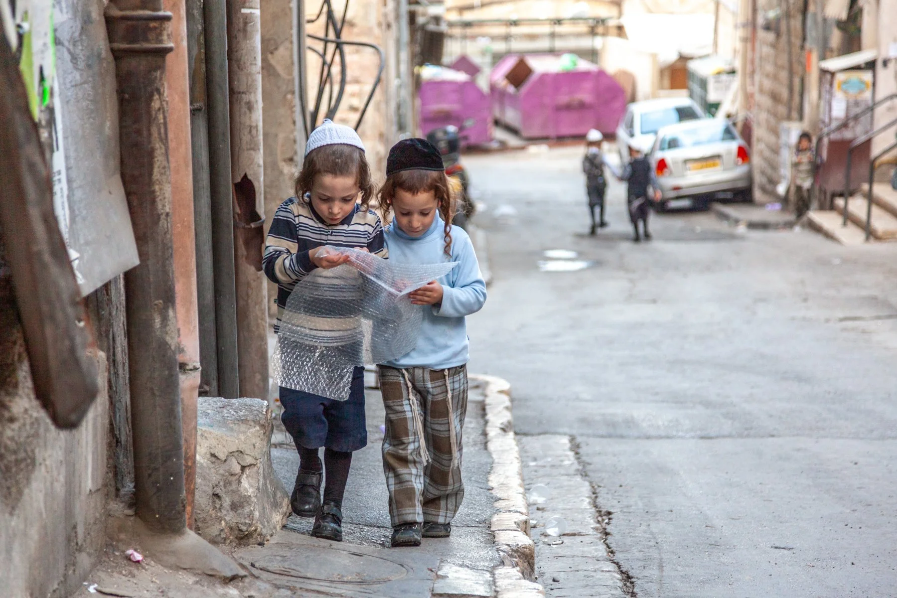 Two Orthodox Jewish boys walking in the Mea Shearim neighborhood of Jerusalem.