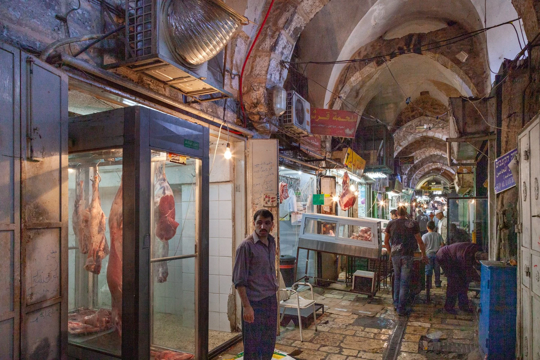 Fresh meat hanging outside butcher shops in Jerusalem’s Old City market.